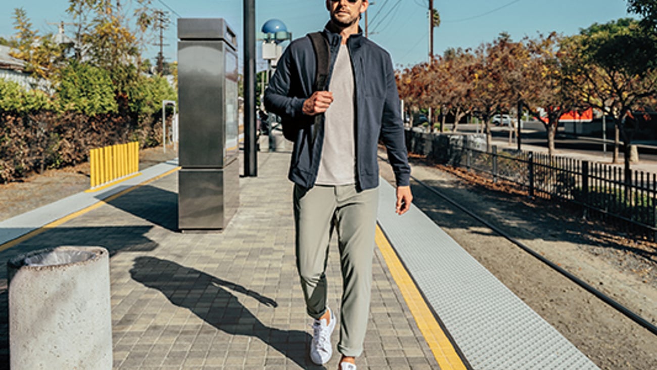 a man standing on a sidewalk