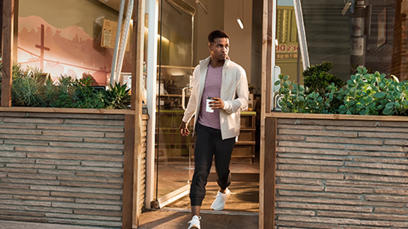 a man standing in front of a building