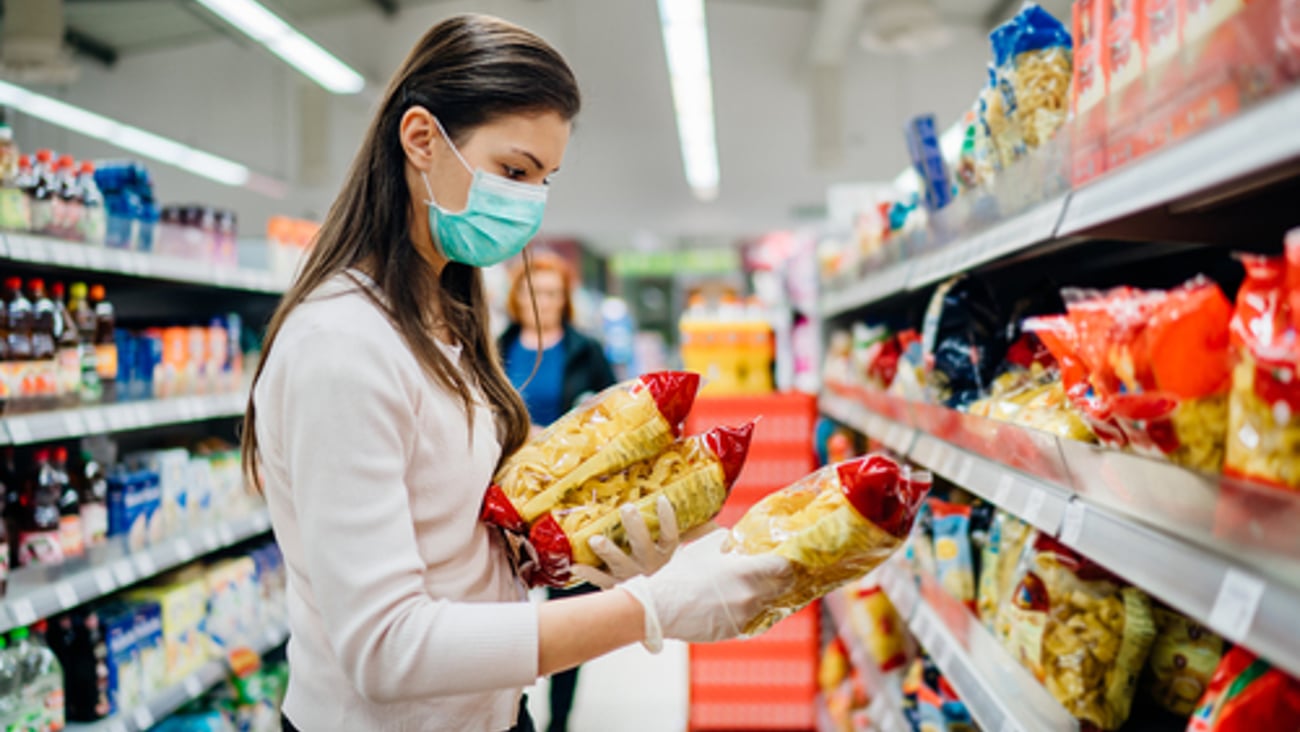 a woman standing in front of a store