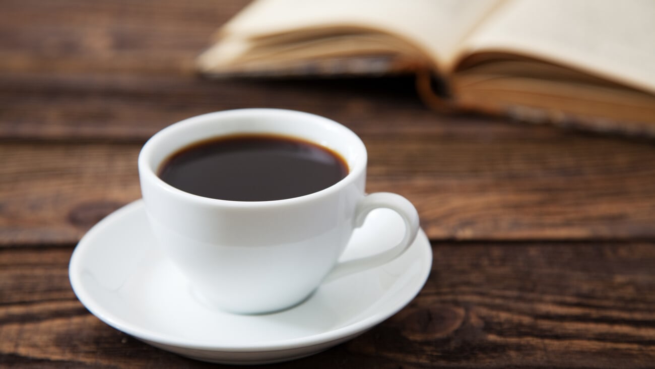 Cup of coffee on a wooden table; Shutterstock ID 116966062