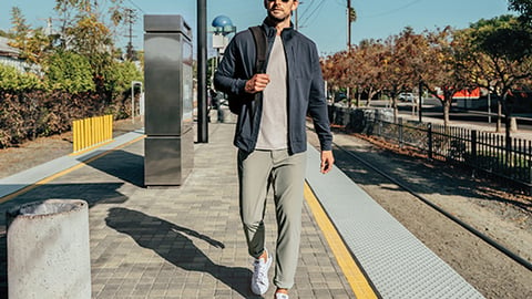 a man standing on a sidewalk