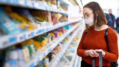 a woman standing in front of a store