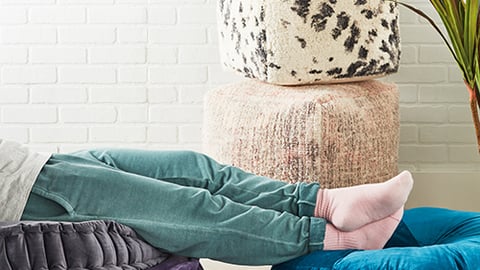 a person sitting on pillows