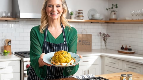 Amanda Freitag cooking food in a kitchen