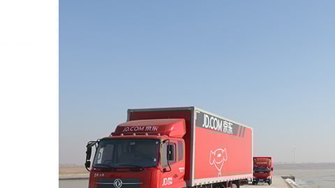 a truck that is driving down the road