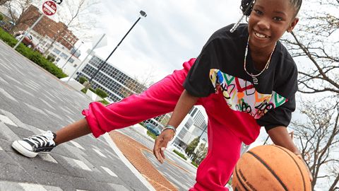 a person holding a basketball