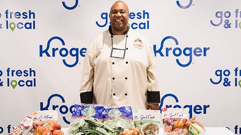 a person standing in front of a plate of food