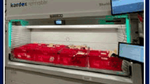 indoor,cabinet,appliance,sitting,monitor,table,computer,room,refrigerator,kitchen,television,living,large,standing
