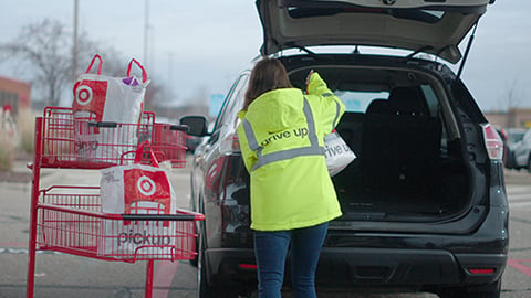 a person standing next to a car