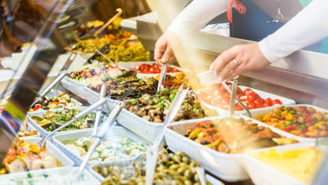 a woman holding a tray of food