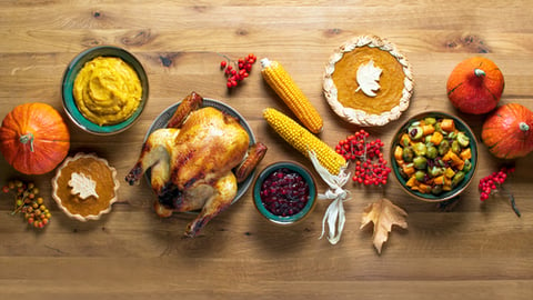 a bunch of food sitting on top of a wooden table