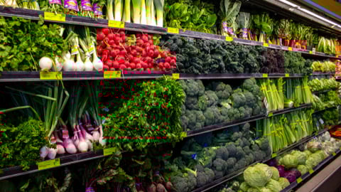 a variety of fruits and vegetables on display in a store