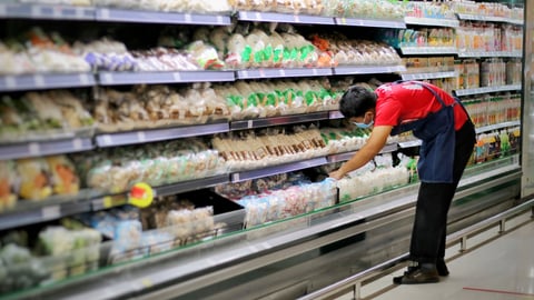 a person standing in front of a store