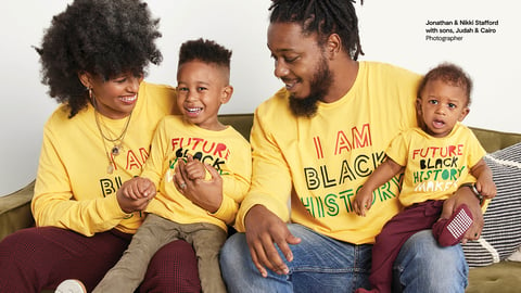 a family in matching yellow shirts