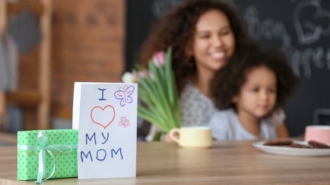 Greeting card and gift for Mother's Day on table in kitchen; Shutterstock ID 1669925827