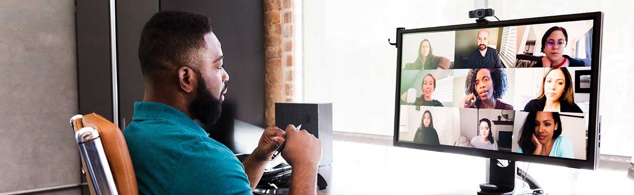 a man standing in front of a screen