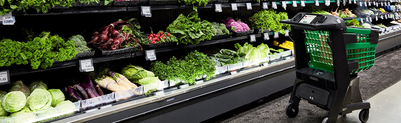 a box filled with different types of vegetables on display