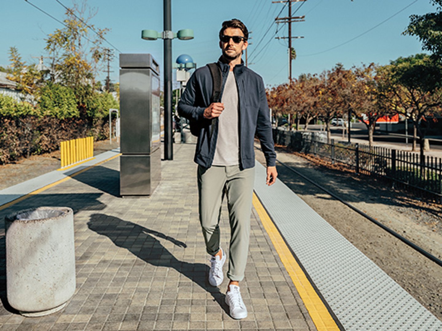 a man standing on a sidewalk