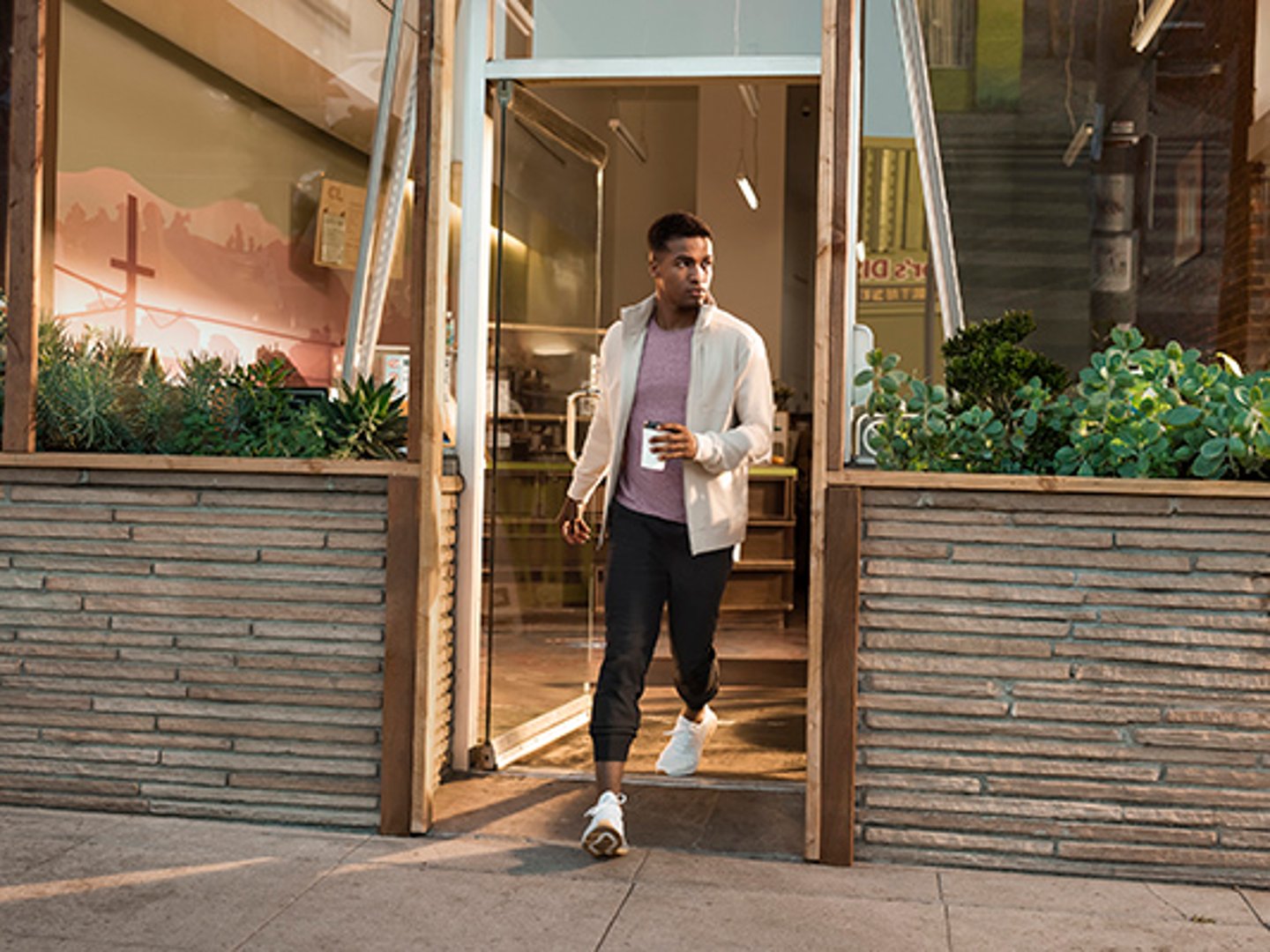 a man standing in front of a building