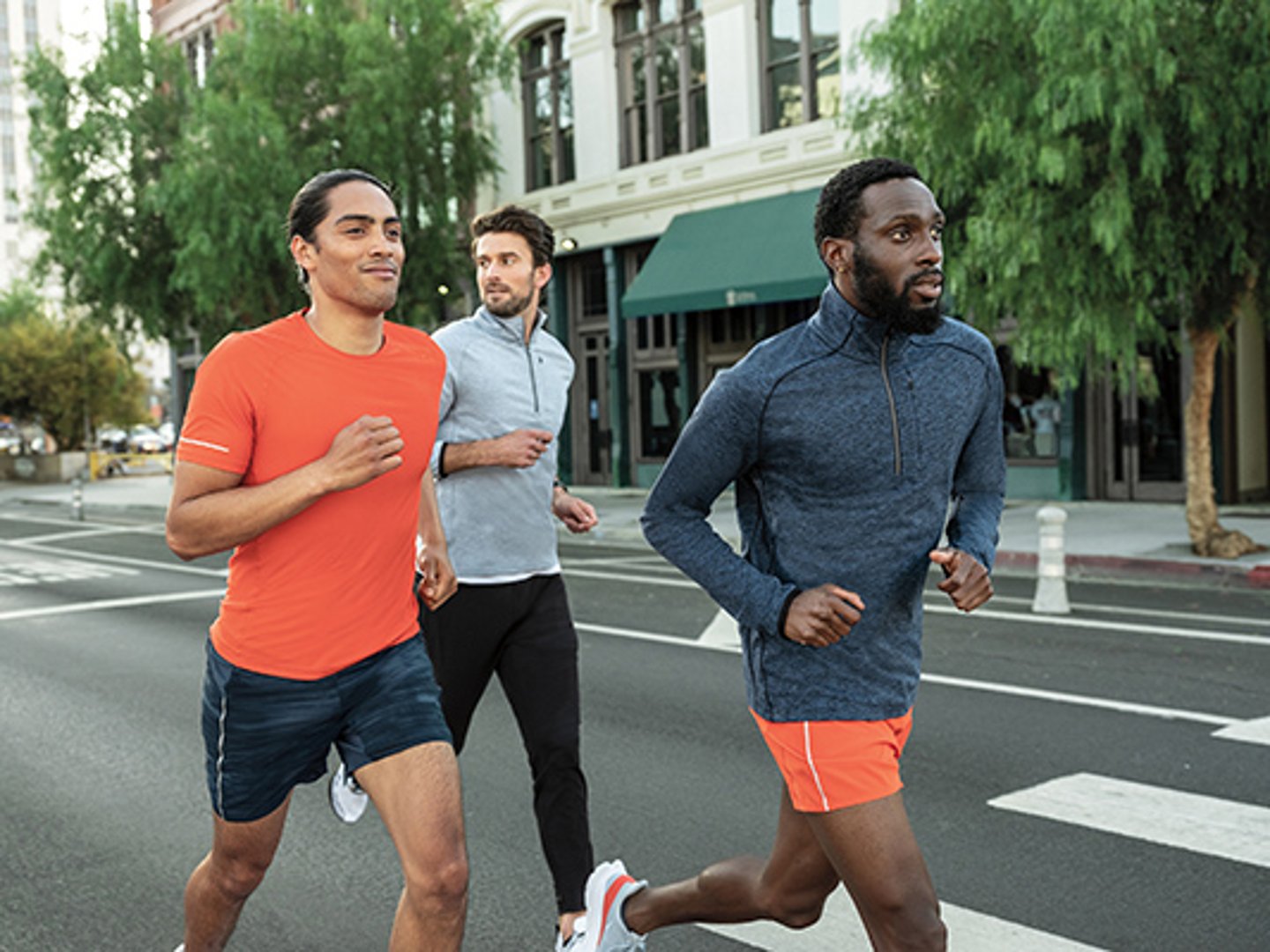 a group of people crossing a street