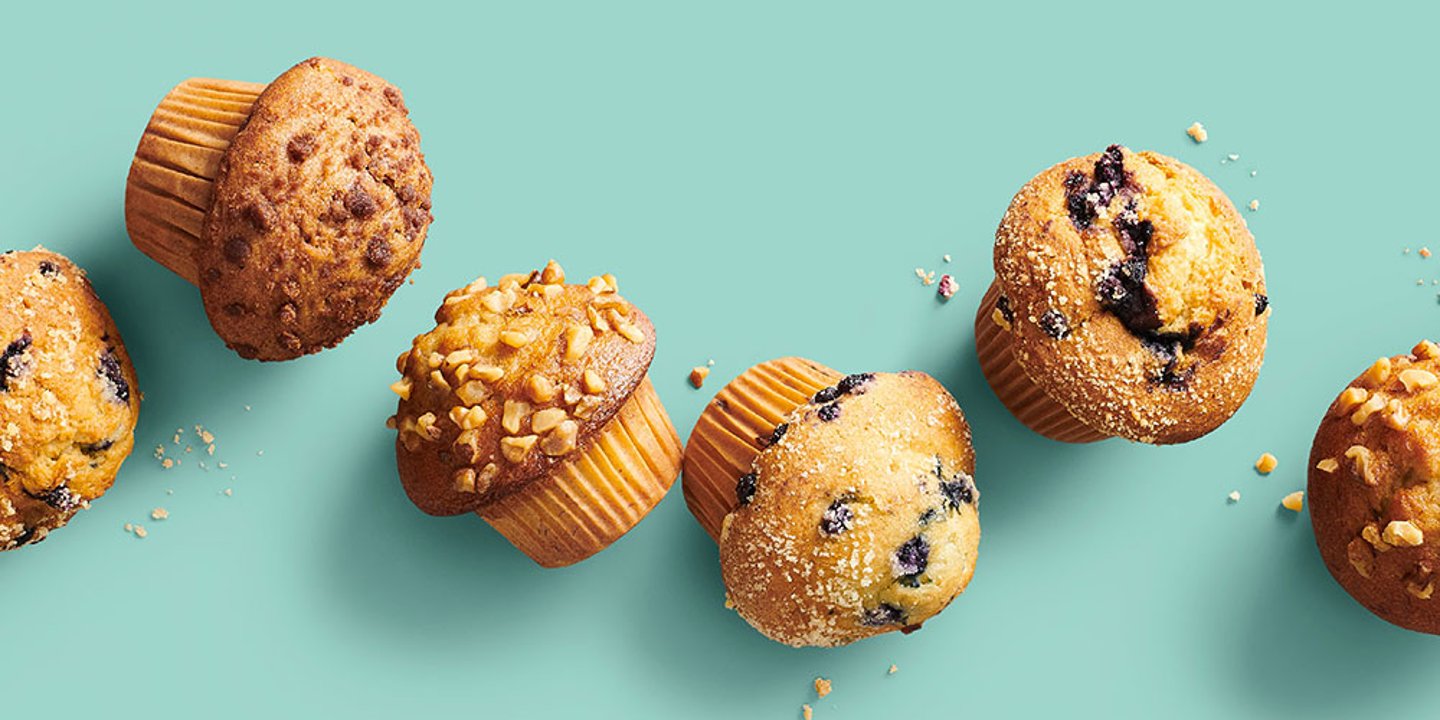 various muffins arranged on an aqua background