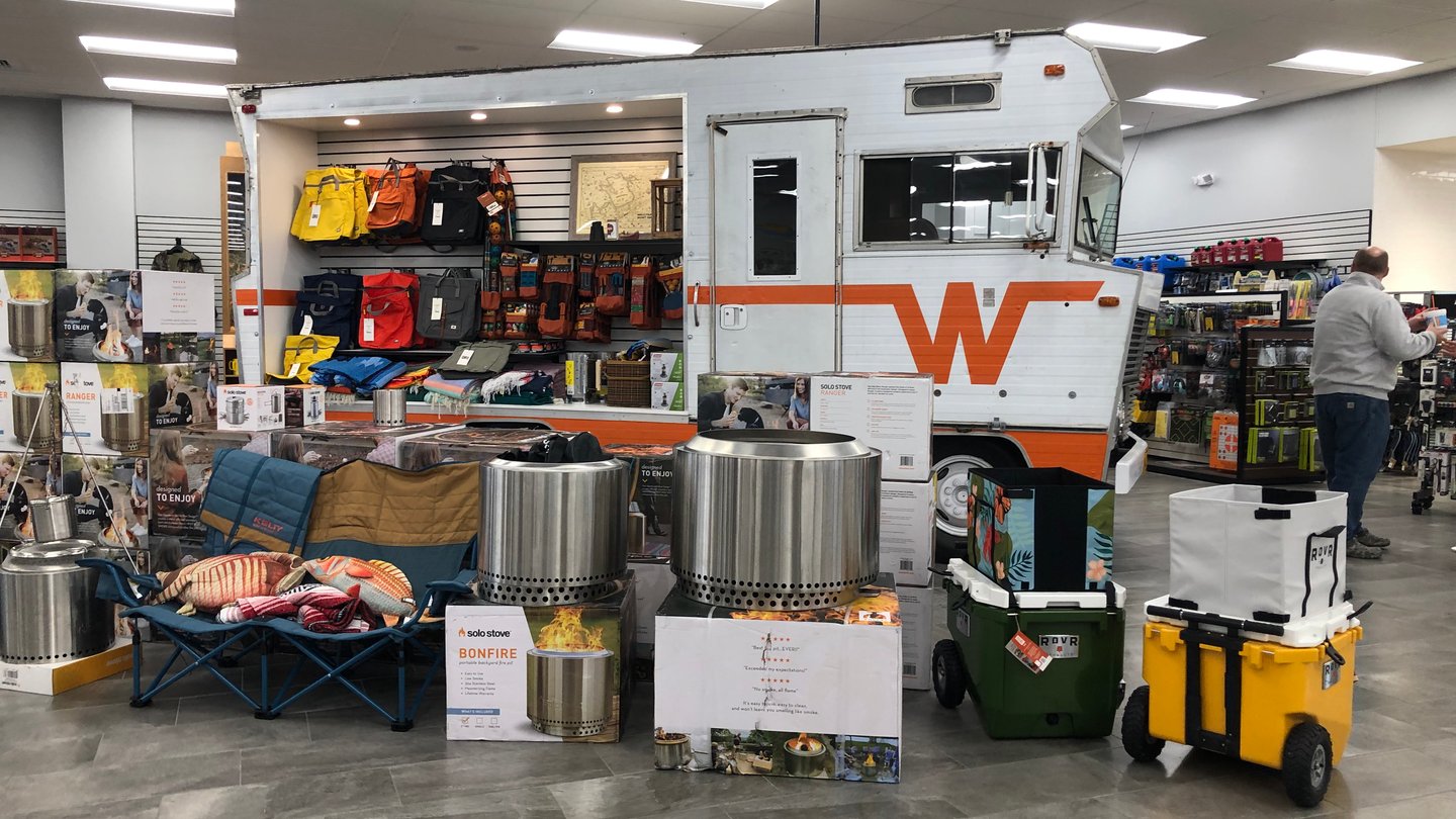 a van inside a store with merchandising