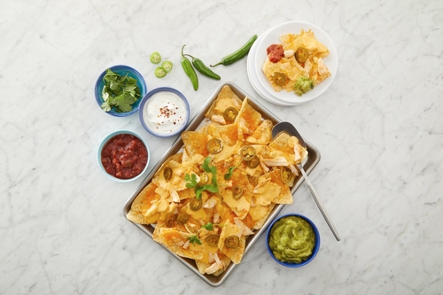 Tee Higgins' Ultimate Sheet Pan Chicken Nachos.
