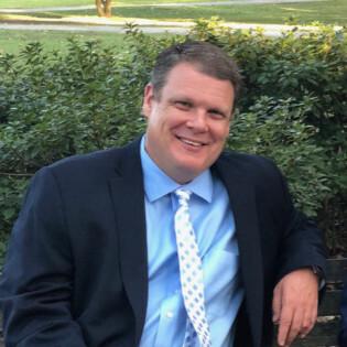 a man wearing a suit and tie