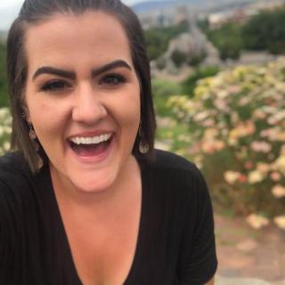 a woman smiling for the camera