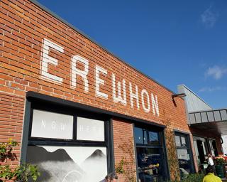 a sign in front of a brick building