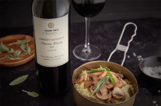 a plate of food and a glass of wine