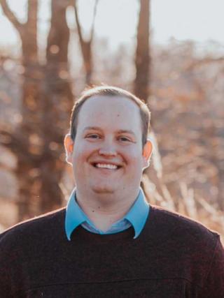 a person smiling for the camera
