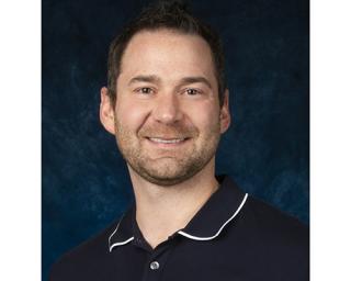 a man smiling for the camera