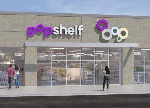 popshelf storefront a group of people standing in front of a building
