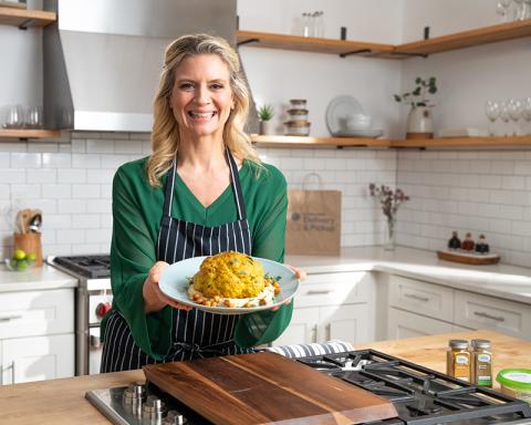 Amanda Freitag cooking food in a kitchen